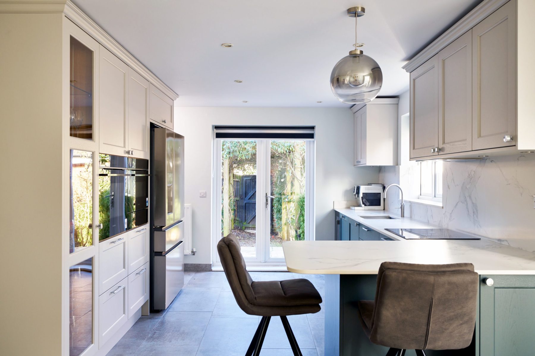 Shaker Kitchen with Dark Green cabinetry and soft neutral wall cabinets
