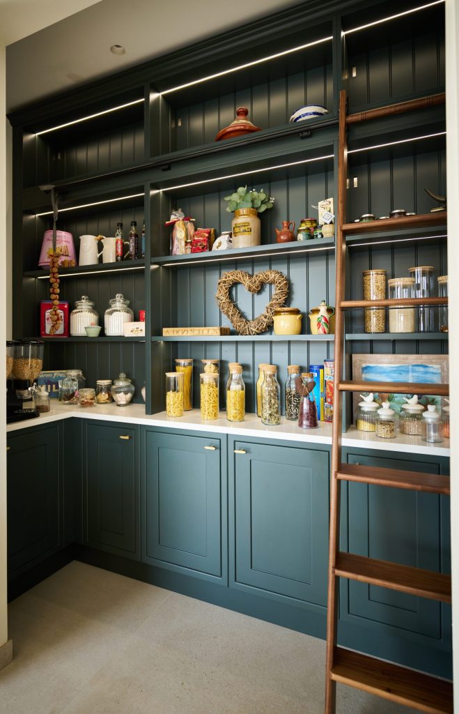 walk in pantry with walnut shelf
