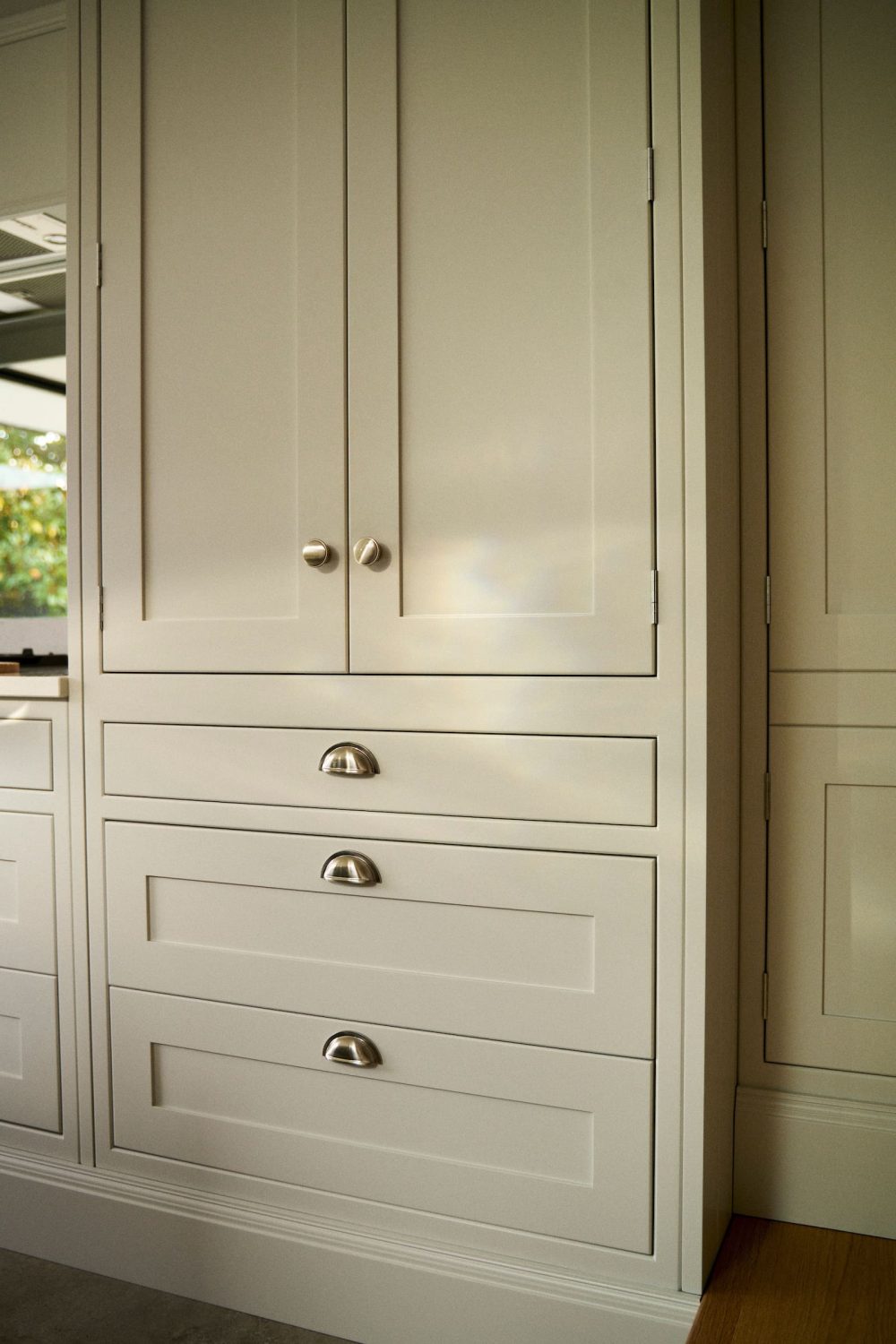 Timeless shaker colour palette, griege cabinets with light hitting creating a beautiful pattern