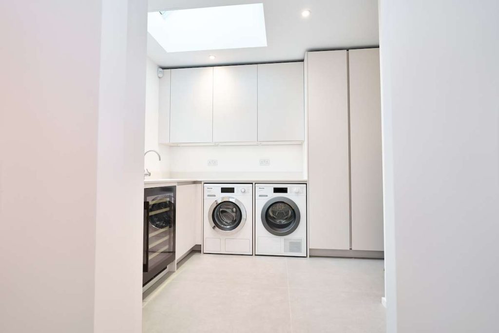 luxury kitchen detail showing marble-effect quartz worktop and under-mounted sink