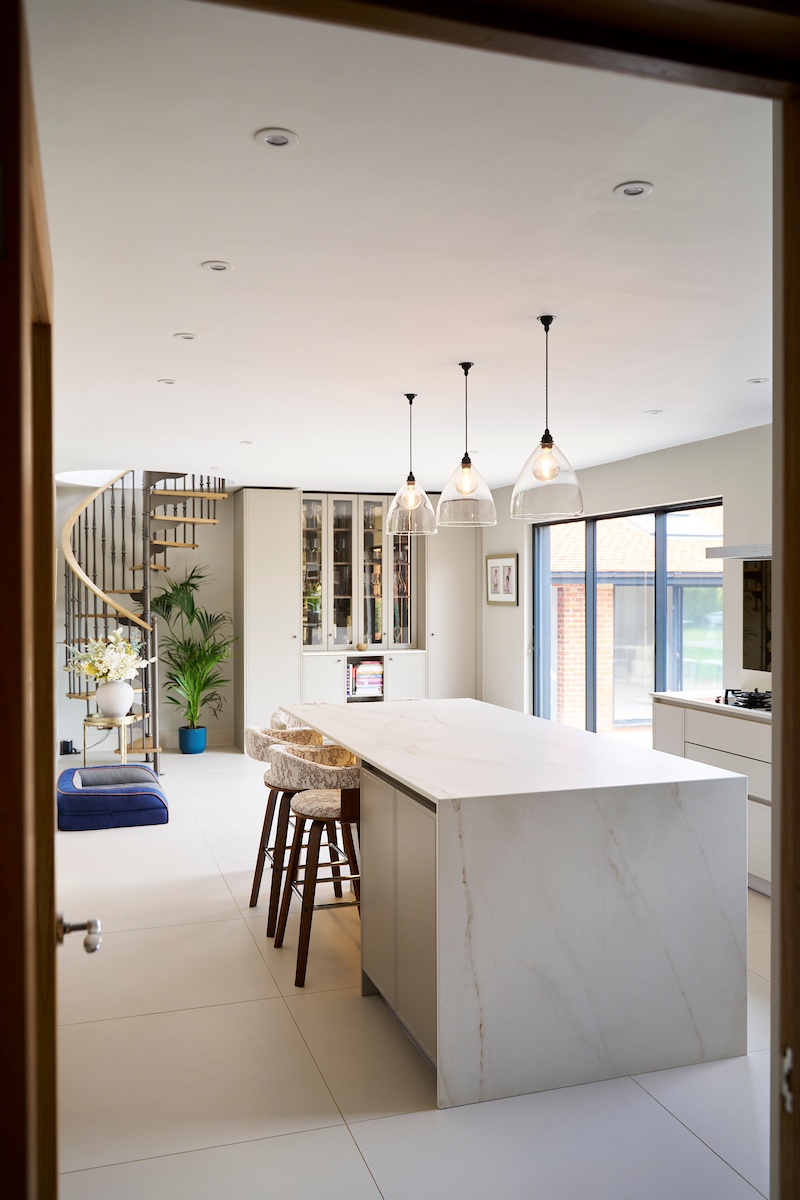 Integrated Miele appliances in a sleek floor-to-ceiling bank, perfect for luxury modern kitchen design.