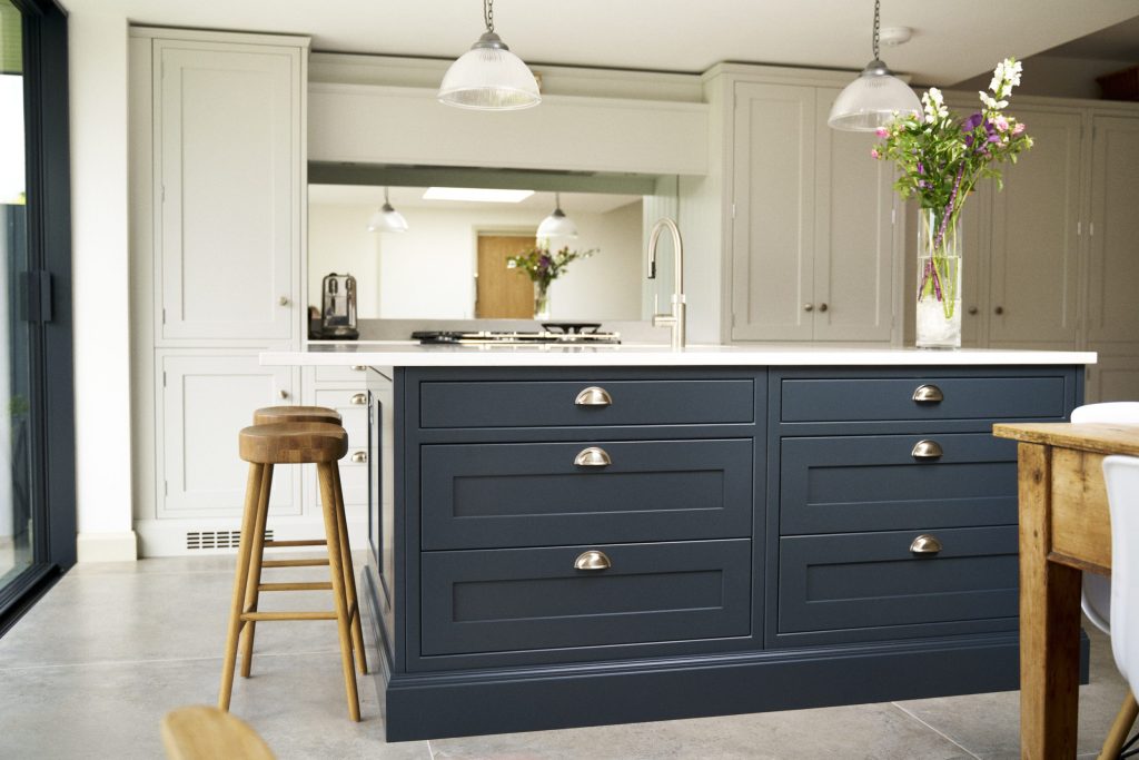 Blue shaker kitchen Island with complimenting light grey shaker wall and floor cabinets