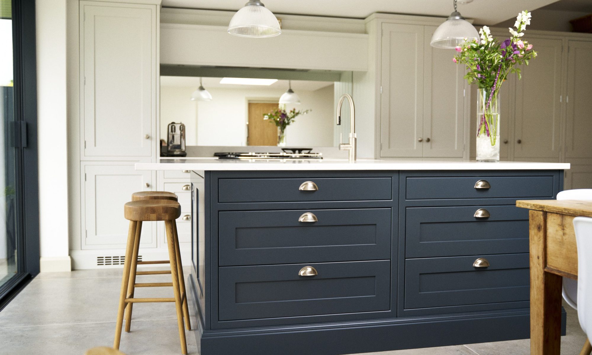 Blue shaker kitchen Island with complimenting light grey shaker wall and floor cabinets